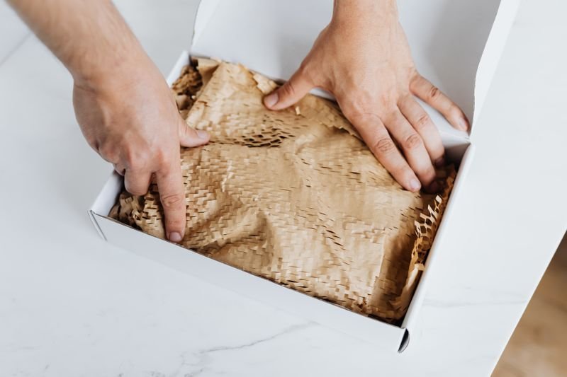 Artisan hands making candles from natural soy wax